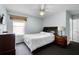 Cozy bedroom features a ceiling fan, window, and a comfortable-looking bed at 283 Willow View Dr, Davenport, FL 33896