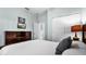 Bright bedroom with a soft color palette, featuring closet and backyard views at 283 Willow View Dr, Davenport, FL 33896
