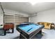 Spacious garage with games and room to relax at 283 Willow View Dr, Davenport, FL 33896