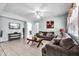 Comfortable living room with tile flooring and a view into the adjacent dining area at 283 Willow View Dr, Davenport, FL 33896