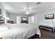 Relaxing main bedroom with ceiling fan, TV, and access to the Primary bath at 283 Willow View Dr, Davenport, FL 33896