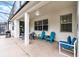 Covered patio with outdoor seating, perfect for relaxing and entertaining guests at 283 Willow View Dr, Davenport, FL 33896