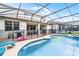 Sparkling screened-in pool and patio area, ideal for outdoor enjoyment and relaxation at 283 Willow View Dr, Davenport, FL 33896