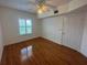 Well-lit bedroom boasts wood floors and a window providing a sunlit view at 304 E South St # 5020, Orlando, FL 32801