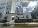 Well-maintained building exterior with lush landscaping and elegant architectural details at 304 E South St # 5020, Orlando, FL 32801