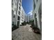 A stunning courtyard showcasing pavers, lush plants, and elegant architecture, perfect for relaxing strolls at 304 E South St # 5020, Orlando, FL 32801