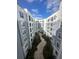 Captivating aerial view of the courtyard with pavers, landscaping, and multiple story residential buildings at 304 E South St # 5020, Orlando, FL 32801