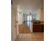 Open floor plan with wood floors, granite kitchen bar, and access to a private balcony at 304 E South St # 5020, Orlando, FL 32801