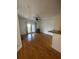 Spacious living room featuring wood floors, ceiling fan, and balcony doors for natural light at 304 E South St # 5020, Orlando, FL 32801