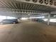 Parking garage with visible parking spaces and parked vehicles, showing ample parking at 304 E South St # 5020, Orlando, FL 32801