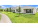 Spacious backyard with lush green grass and a patio perfect for outdoor living at 306 Alexandrite St, Deland, FL 32720