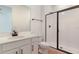 Well-lit bathroom features a glass-enclosed shower and modern fixtures at 306 Alexandrite St, Deland, FL 32720