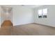 Bright living space with wood-look floors and a large window offering outdoor views at 306 Alexandrite St, Deland, FL 32720