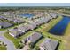Neighborhood featuring beautiful homes, landscaped yards, and tranquil water views at 307 Bella Cortina Dr, Kissimmee, FL 34759