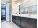 Bathroom features double sinks, a large mirror, and a large glass shower at 307 Bella Cortina Dr, Kissimmee, FL 34759