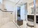 Modern bathroom featuring a glass-enclosed shower with a built-in bench and contemporary fixtures at 307 Bella Cortina Dr, Kissimmee, FL 34759