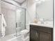Modern bathroom with a glass-enclosed shower, vanity, and contemporary fixtures at 307 Bella Cortina Dr, Kissimmee, FL 34759