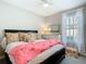 Comfortable bedroom with decorative pillows, dresser, and serene atmosphere at 307 Bella Cortina Dr, Kissimmee, FL 34759