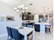 Open dining area with chandelier that flows into the kitchen and living room at 307 Bella Cortina Dr, Kissimmee, FL 34759