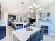 Open dining area with views into the modern kitchen and living room at 307 Bella Cortina Dr, Kissimmee, FL 34759