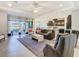 Bright and airy living room connecting to the kitchen and patio, perfect for entertaining guests at 307 Bella Cortina Dr, Kissimmee, FL 34759