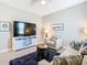 Comfortable living area with a large screen television and neutral tones at 307 Bella Cortina Dr, Kissimmee, FL 34759