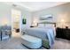 Spacious main bedroom features a large bed, and bathroom access at 307 Bella Cortina Dr, Kissimmee, FL 34759