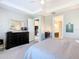 The main bedroom features a dresser, an accent mirror and doorways to other rooms at 307 Bella Cortina Dr, Kissimmee, FL 34759