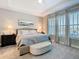This is the main bedroom featuring a large bed and big bright windows at 307 Bella Cortina Dr, Kissimmee, FL 34759