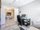 Bright office space with desk, chair, modern décor, and an open doorway to another room at 307 Bella Cortina Dr, Kissimmee, FL 34759