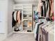 Well-organized walk-in closet with shelves and hanging rods for efficient storage solutions at 307 Bella Cortina Dr, Kissimmee, FL 34759