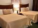 Comfortable bedroom with two beds and tasteful decor for a relaxing stay at 3100 Parkway Blvd # 113, Kissimmee, FL 34747
