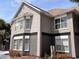 Attractive townhouse with a neutral color scheme and well-maintained landscaping at 3100 Parkway Blvd # 113, Kissimmee, FL 34747