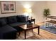 Cozy living room featuring a comfortable couch and modern decor at 3100 Parkway Blvd # 113, Kissimmee, FL 34747