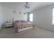 Bright bedroom with a ceiling fan, a comfortable bed with colorful bedding, and natural light from the windows at 3173 Armstrong Spring Dr, Kissimmee, FL 34744