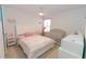 Charming bedroom featuring a crib, a single bed, and white walls, creating a cozy atmosphere at 3173 Armstrong Spring Dr, Kissimmee, FL 34744