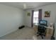 An office with a built-in desk with drawers, a rolling chair, bright window, and a ceiling fan at 3173 Armstrong Spring Dr, Kissimmee, FL 34744