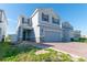 Charming two-story home featuring a two-car garage and stone accents at 3173 Armstrong Spring Dr, Kissimmee, FL 34744