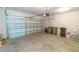 Open garage with a white garage door, room for storage and parking space at 3173 Armstrong Spring Dr, Kissimmee, FL 34744