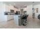 Well-equipped kitchen features an island with bar seating, stainless appliances, and ample cabinet space at 3173 Armstrong Spring Dr, Kissimmee, FL 34744