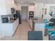 Open-concept kitchen boasts granite countertops, stainless appliances, and a breakfast bar at 3173 Armstrong Spring Dr, Kissimmee, FL 34744