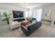 Comfortable living area featuring stylish seating, a media center, and a bright window at 3173 Armstrong Spring Dr, Kissimmee, FL 34744