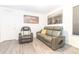 Cozy living room featuring modern seating, artwork, and contemporary flooring at 3173 Armstrong Spring Dr, Kissimmee, FL 34744