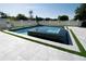 Stylish pool featuring a integrated spa and decorative landscaping and pavers at 3173 Armstrong Spring Dr, Kissimmee, FL 34744