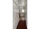 Hallway bathroom featuring a soaking tub, vanity and laminate floors at 322 Ashburton Way, Kissimmee, FL 34758