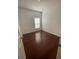 Cozy bedroom features hardwood flooring and a window at 322 Ashburton Way, Kissimmee, FL 34758