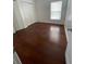 A bright bedroom with beautiful wood floors, a window with blinds, and a closet with sliding doors at 322 Ashburton Way, Kissimmee, FL 34758