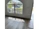 Bright entryway featuring a large window, modern flooring, and plenty of natural light at 322 Ashburton Way, Kissimmee, FL 34758