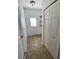 Hallway with tile floors, window, and closet at 322 Ashburton Way, Kissimmee, FL 34758
