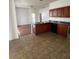 Kitchen and Dining Room with tile floors, black appliances, and laminate floors at 322 Ashburton Way, Kissimmee, FL 34758